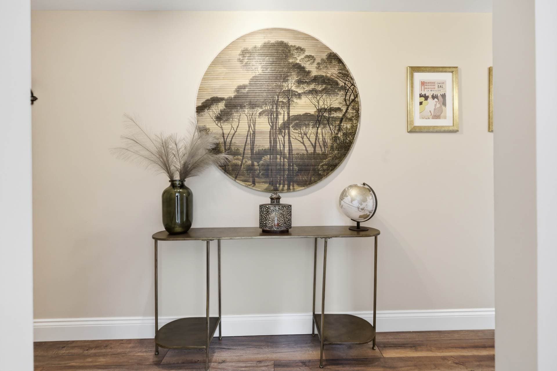 Hallway console table with decorative artwork and ornaments