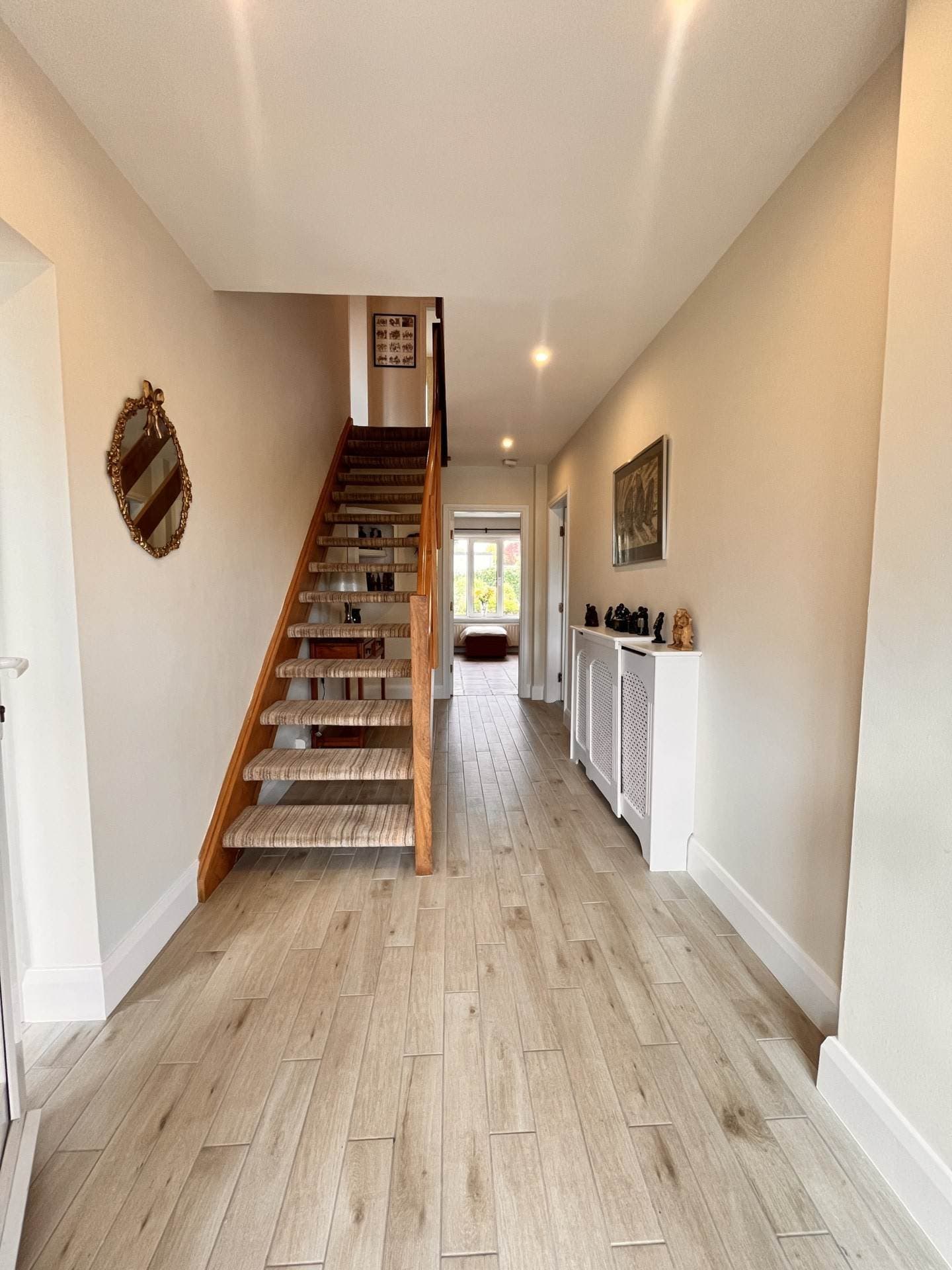 Entrance hallway with staircase and wood-effect flooring